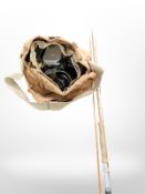 A vintage three piece split cane fishing rod,