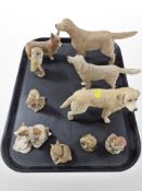 A group of resin animal figures, several by Border Fine Arts including labradors, owls,
