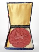 A Chinese cinnabar lacquer plate depicting a ship at sea,