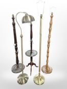 Five various wood and brass standard lamps