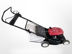 A petrol lawnmower with Honda engine.