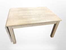 A contemporary Danish blond oak extending drop-leaf coffee table, width 100cm (unextended).
