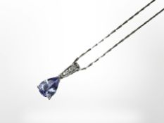 An 18ct white gold tanzanite and diamond pendant on chain, pendant 22mm long.