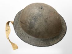 A First World War tin helmet.