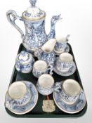 A Capo Di Monte fifteen piece pottery coffee service, decorated with cherubs.