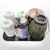 Three enameled kitchen storage jars, a reproduction Delft pewter mounted tankard,