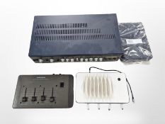 A Radio Shack electronic reverb control, a Carlsbro Cobra 1300 amplifier and two WiFi routers.