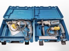 Two Makita drills in plastic cases.