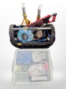 A JCB toolbag containing assorted tools and hardware,