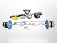 A barbell, two dumbells and five kettle bells.