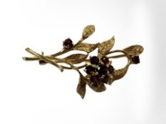 A 9ct yellow gold brooch set with garnets, length 45 mm CONDITION REPORT: 4.