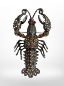 A large two part lobster brooch plated in rhodium