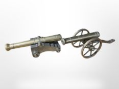 Two miniature brass cannons,
