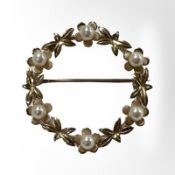 A 9ct yellow gold floral brooch set with seed pearls,