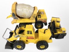 A group of Tonka die cast metal excavators, cement truck, etc.