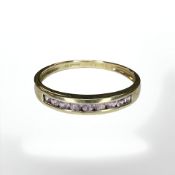 A 9ct gold pink quartz channel set ring, size V CONDITION REPORT: 2.