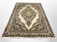 A machine made carpet of Iranian design,