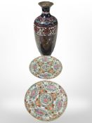 A late 19th century Japanese cloisonne enamel vase, height 31 cm, and two Cantonese export plates.