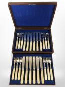 A canteen containing a twelve place setting EPNS fish cutlery service with faux ivory handles
