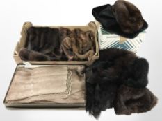 A group of fur stoles, Bainbridges hat box containing fur hats, etc.