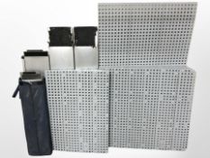 Two pairs of vehicle loading ramps and a quantity of clip-together plastic floor surfacing