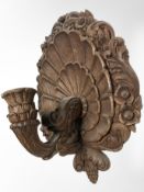 A continental heavily carved oak Baroque style candle sconce, height 40 cm.