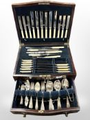 A mahogany serpentine-front cutlery canteen and a part EPNS table service