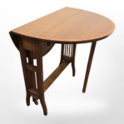 An Edwardian mahogany Sutherland table,