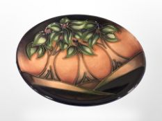 A modern Moorcroft 'New Forest' pin dish, dated 2006, diameter 12 cm, with original box.