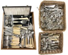 A wooden tray and two wicker trays containing a very large quantity of assorted silver plated