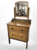 An Edwardian carved oak dressing chest,