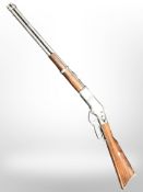 A die cast metal replica lever-action rifle, length 100 cm.