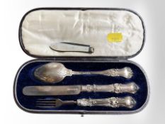 A boxed silver knife fork and spoon set, together with a silver and mother of pearl fruit knife.