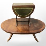 A reproduction inlaid mahogany oval coffee table,