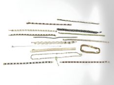 Fourteen various bracelets including a three-tone Italian silver herringbone link example,