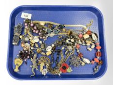 A group of costume jewellery, necklaces, brooches,
