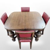 An oak extending dining table, on carved bulbous legs and X-framed under stretcher,