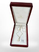 An 18ct gold diamond and pearl pendant upon a 9ct gold chain.
