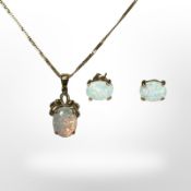 A 9ct gold mounted opal pendant on 9ct gold chain, together with matching pair of opal earrings.