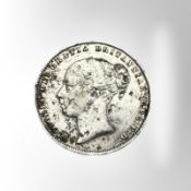 A Victorian 1859 silver shilling.