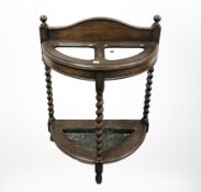 A late Victorian oak barley twist umbrella stand, height 79 cm.