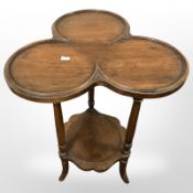An Edwardian mahogany clover-shaped occasional table, height 64 cm.