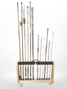A group of fishing rods on bespoke stand,
