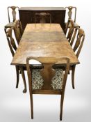 A 20th century walnut extending dining table,