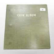 A large album of British 20th century coins, including crowns, half crowns, two shillings,