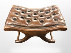 A reproduction mahogany Chesterfield buttoned leather X-framed stool,