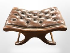A reproduction mahogany Chesterfield buttoned leather X-framed stool,