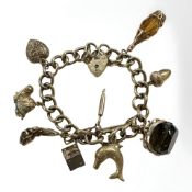 A 9ct gold charm bracelet CONDITION REPORT: 35.