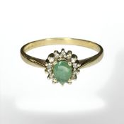 A 9ct gold emerald and diamond cluster ring, size U1/2 CONDITION REPORT: 2.