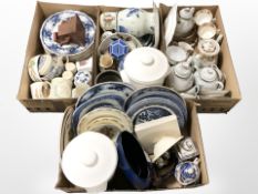 A large quantity of assorted ceramics, kitchen storage jars, willow pattern plates,